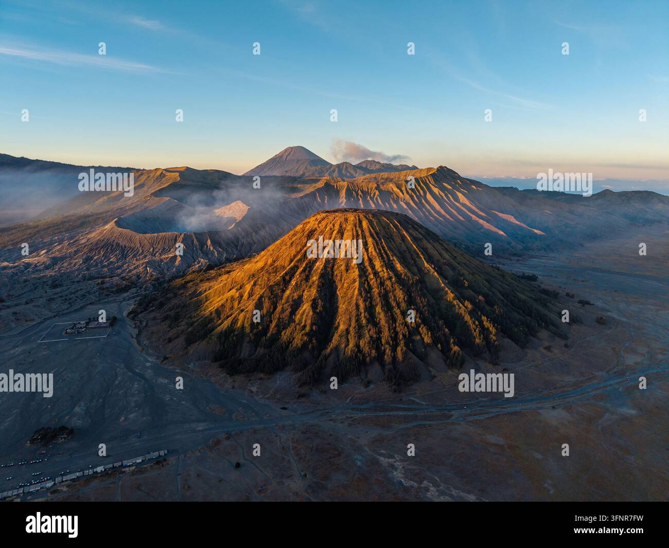 Golden light bathes volcanic peaks hi-res stock photography and images ...