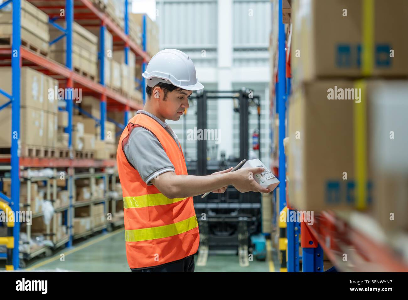 Box File Preview Warehouse worker pick box goods in inventory and check stock product ...