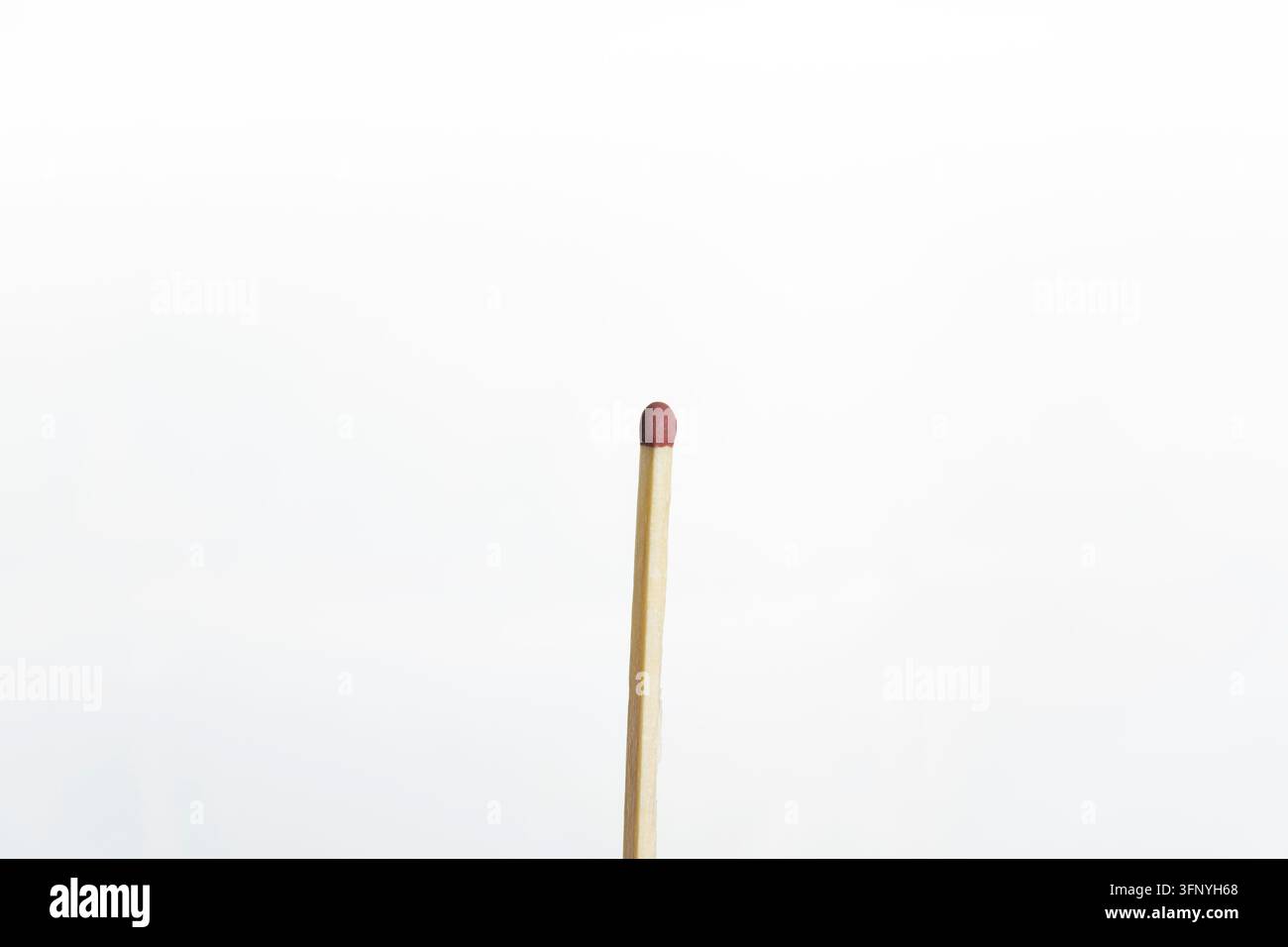 Close-up isolated photo of a single unlit wooden matchstick with a ...