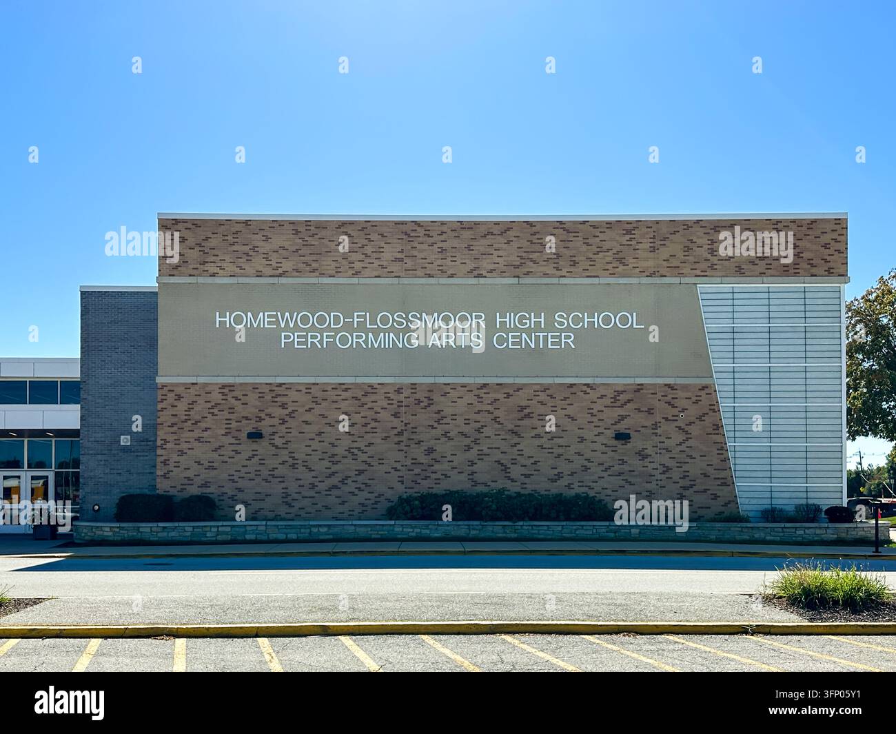 Homewood-Flossmoor High School performing arts center brick building exterior. Flossmoor, IL USA - October 4, 2026 - Smartphone Captured Stock Image
