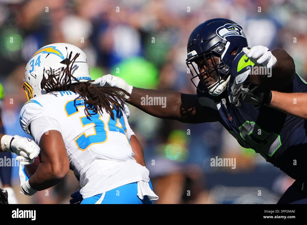 Seattle Seahawks nose tackle Jarran Reed (90) reaches to tackle Los ...