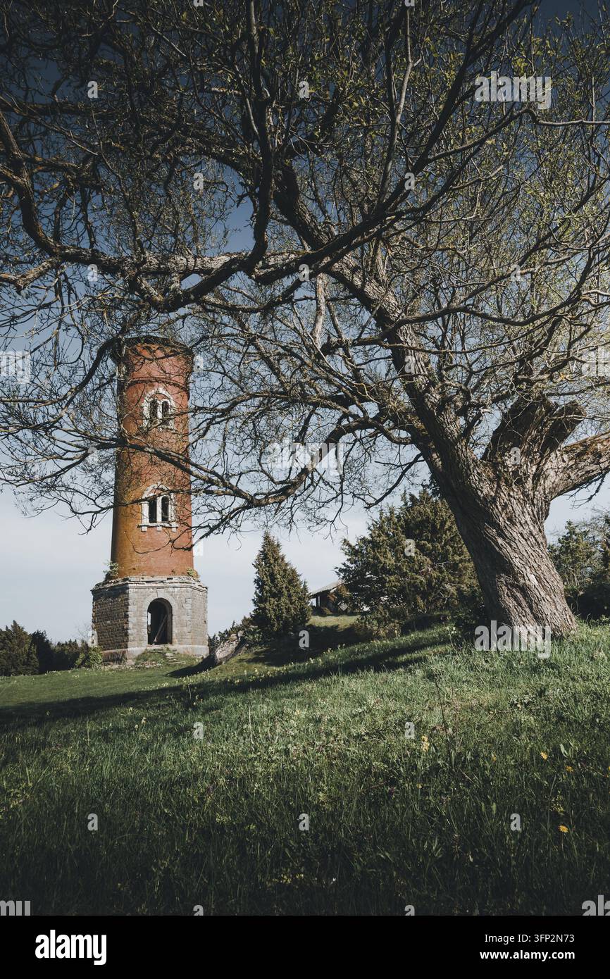 Vector Viewpoint Example View of the historic red brick Laidunina lighthouse surrounded by a ...