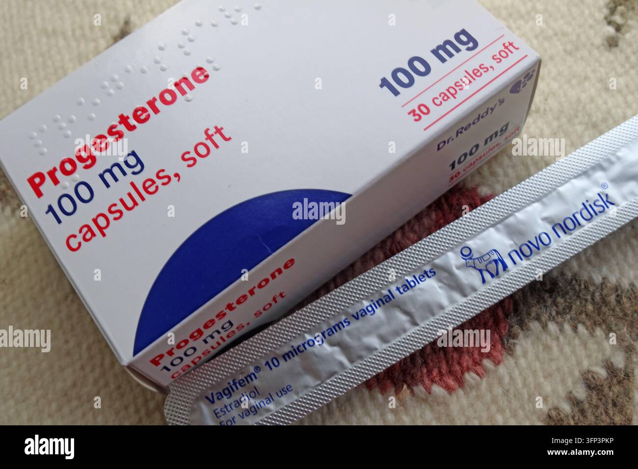 Progesterone 100mg soft capsules beside Vagifem 10 microgram estradiol vaginal tablets, medicines used in menopause hormone replacement therapy. Stock Photo