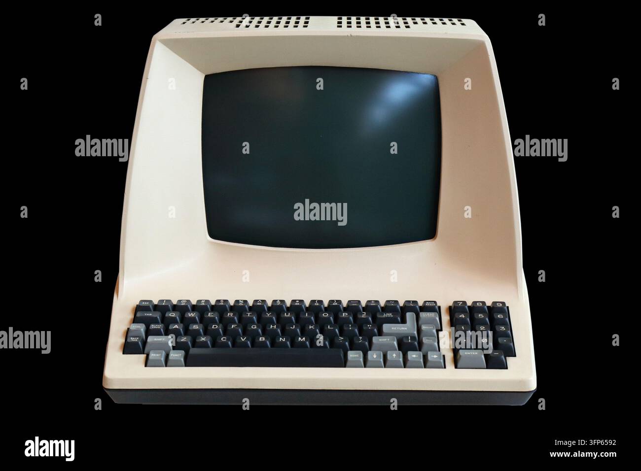 Old personal computer isolated on black background. Vintage PC. Stock Photo