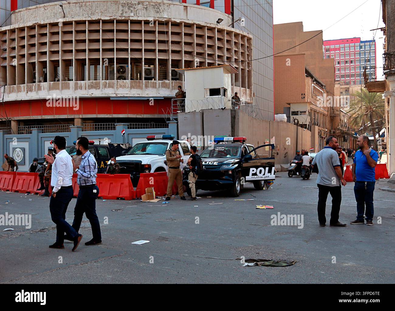 File Size Px FILE -Employees of Iraq central bank, in the background, leave while ...