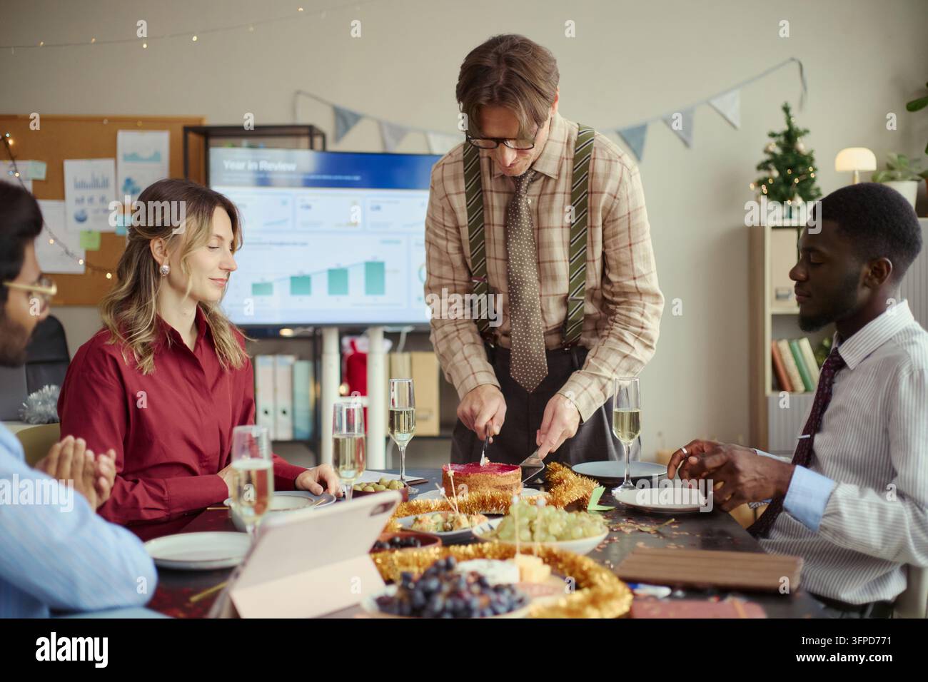 Diverse Business Team Celebrating Holiday Party at Office Table Stock Photo