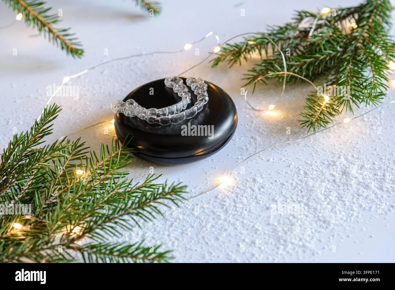 Clear Retyainers Clear dental aligners stored in open orthodontic case under Christmas ...