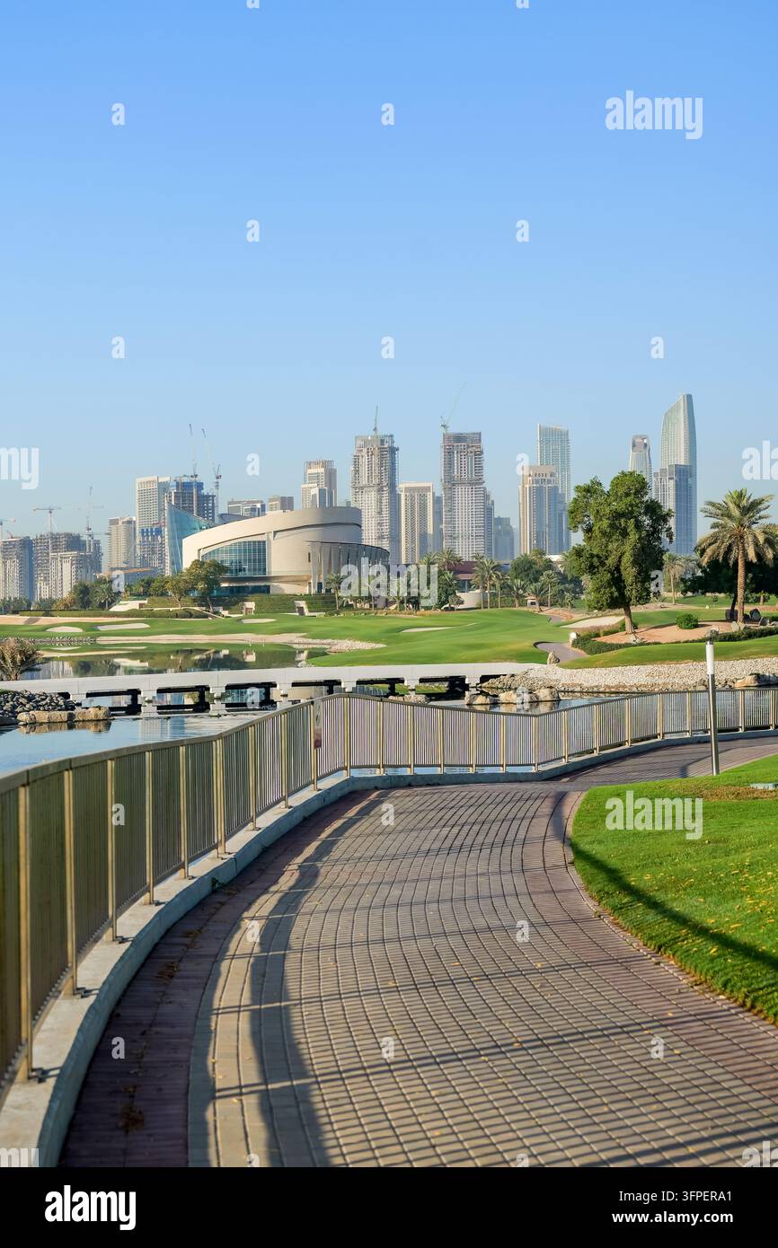 Course Development Model Image Modern Dubai Creek Harbour skyline surrounded by green golf course ...