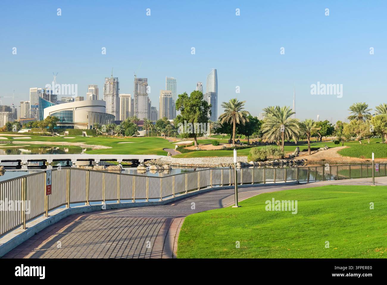 Course Development Model Image Modern Dubai Creek Harbour skyline surrounded by green golf course ...