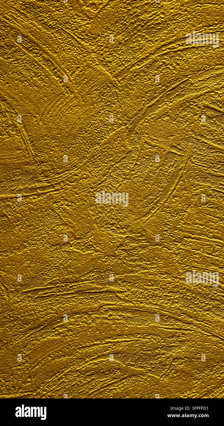 Golden yellow textured surface with swirling patterns and abstract relief Stock Photo