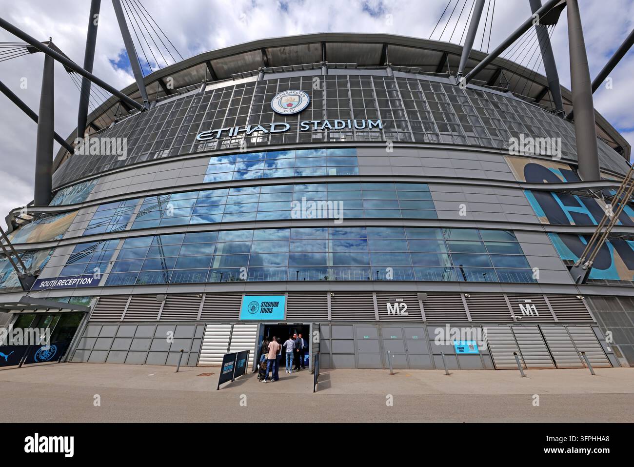 Manchester City Etihad Stadium south reception entrance beneath broad curved exterior Stock Photo