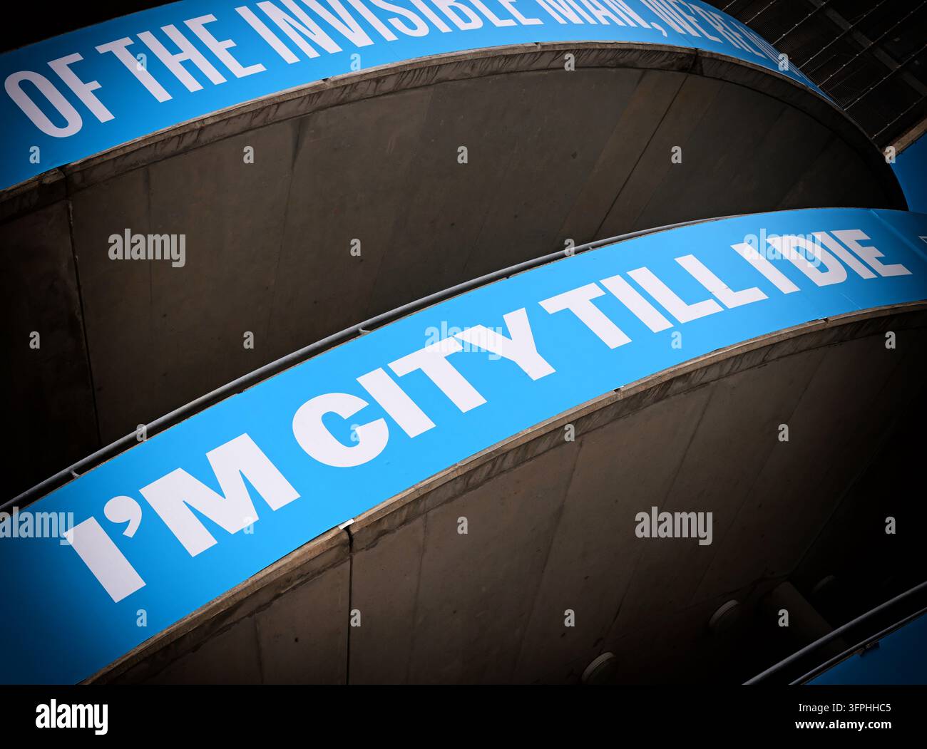 I'm City Till I Die message wrapped around Etihad Stadium structure in Manchester Stock Photo