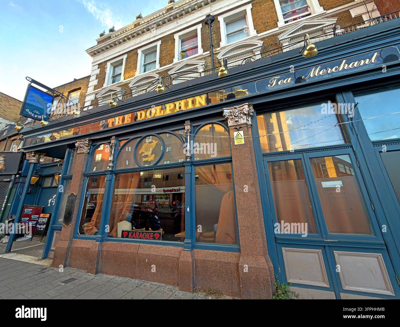 The Dolphin public house on Mare Street in Hackney London with its traditional blue frontage Stock Photo