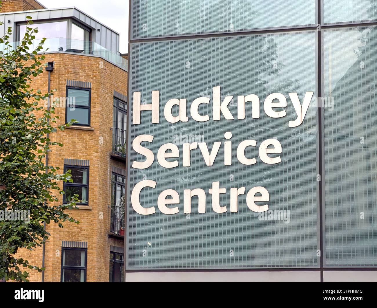 Hackney Service Centre name displayed on glass frontage of a local authority building Stock Photo