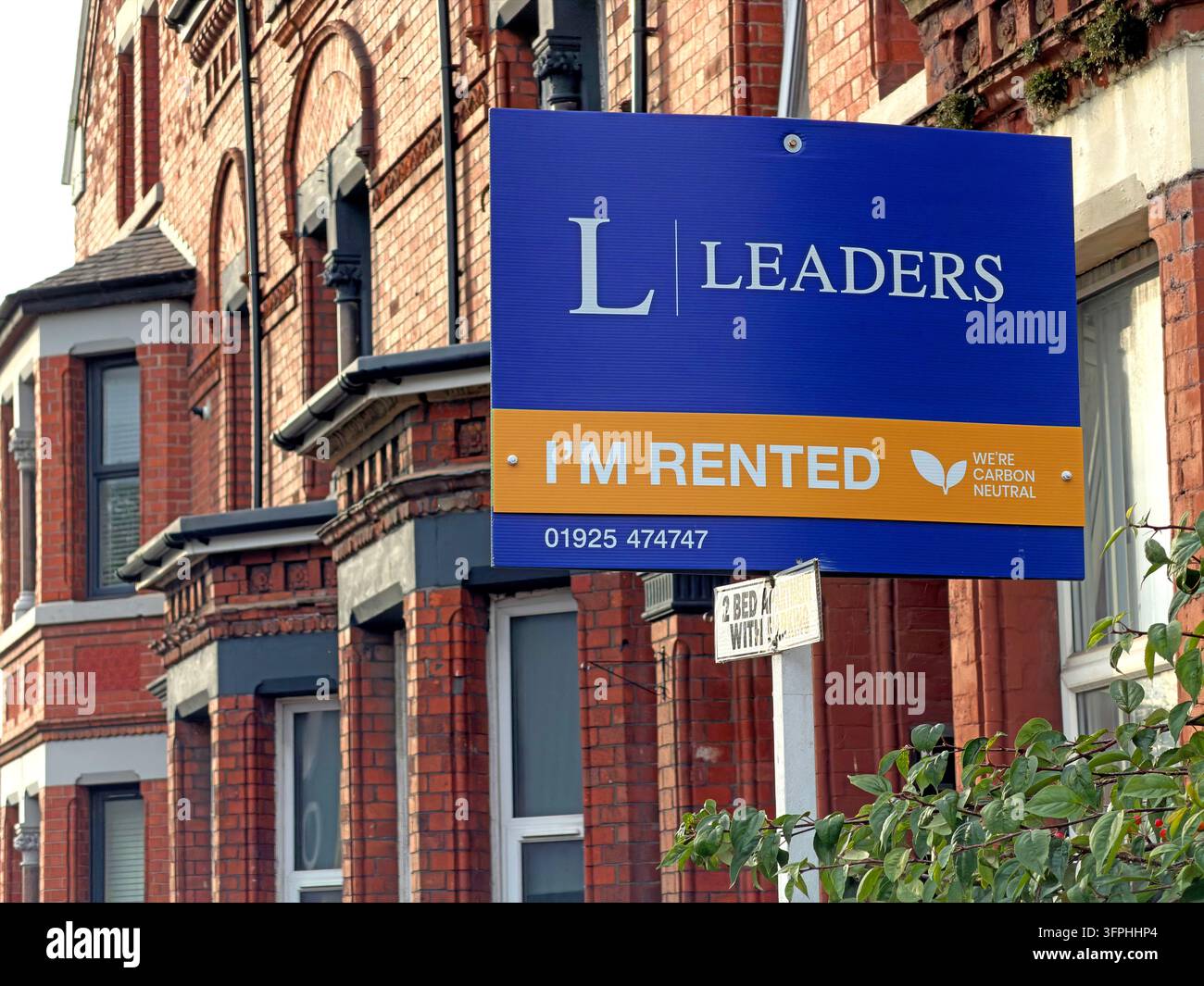 Leaders rented property board outside brick terraced housing in Warrington Stock Photo