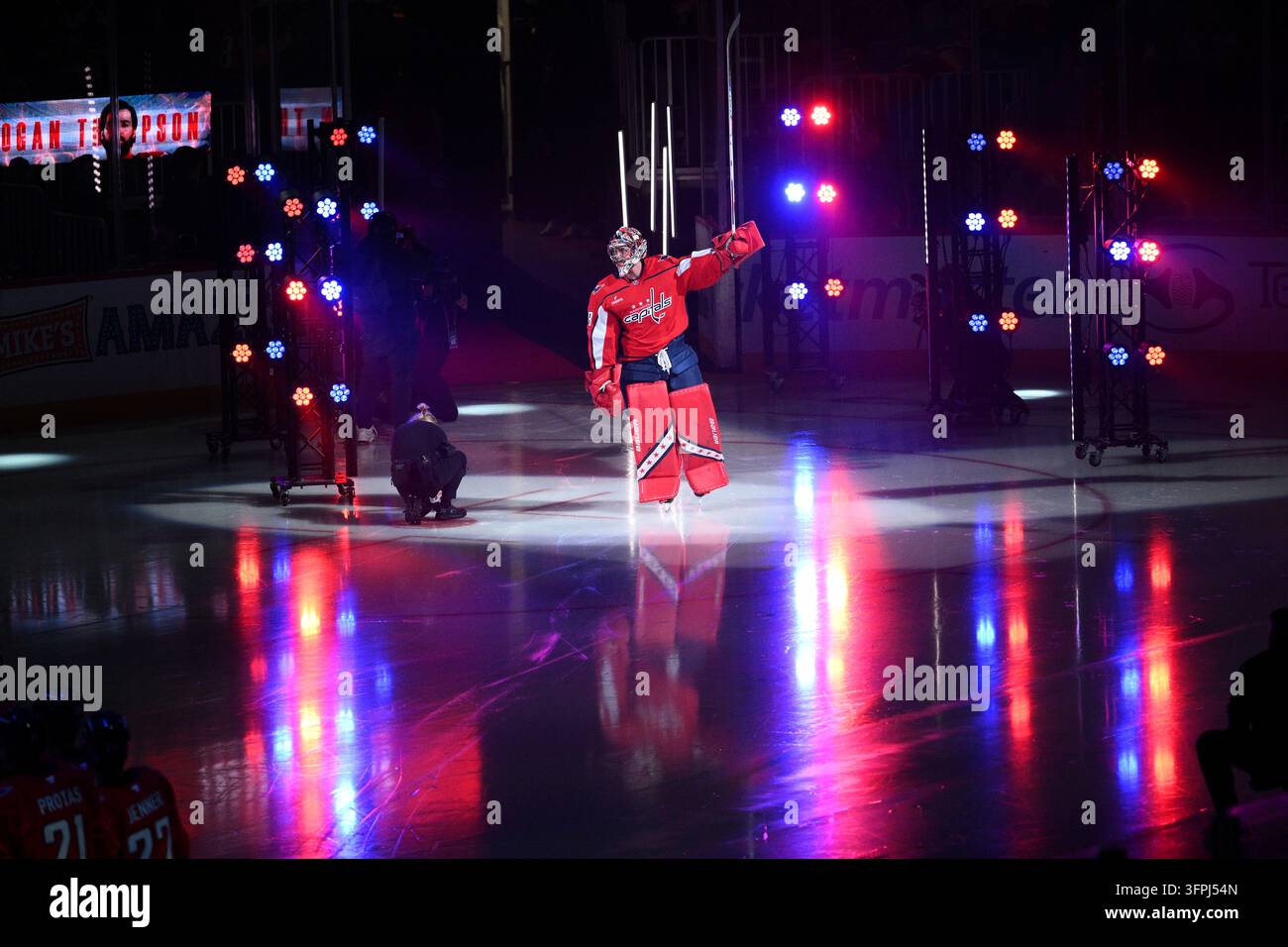 Inftroductions Washington Capitals goaltender Logan Thompson raises his stick during ...