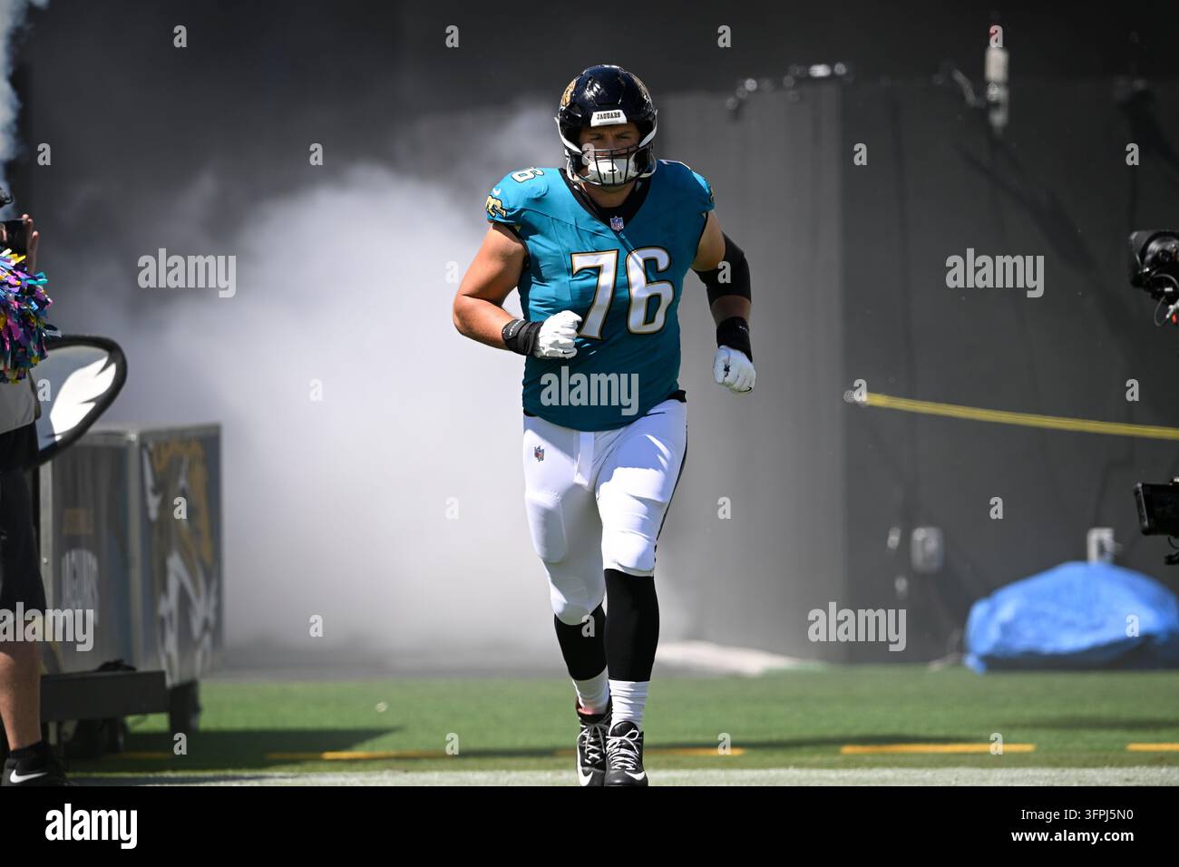 Inftroductions Jacksonville Jaguars guard Ezra Cleveland (76) runs onto the field ...