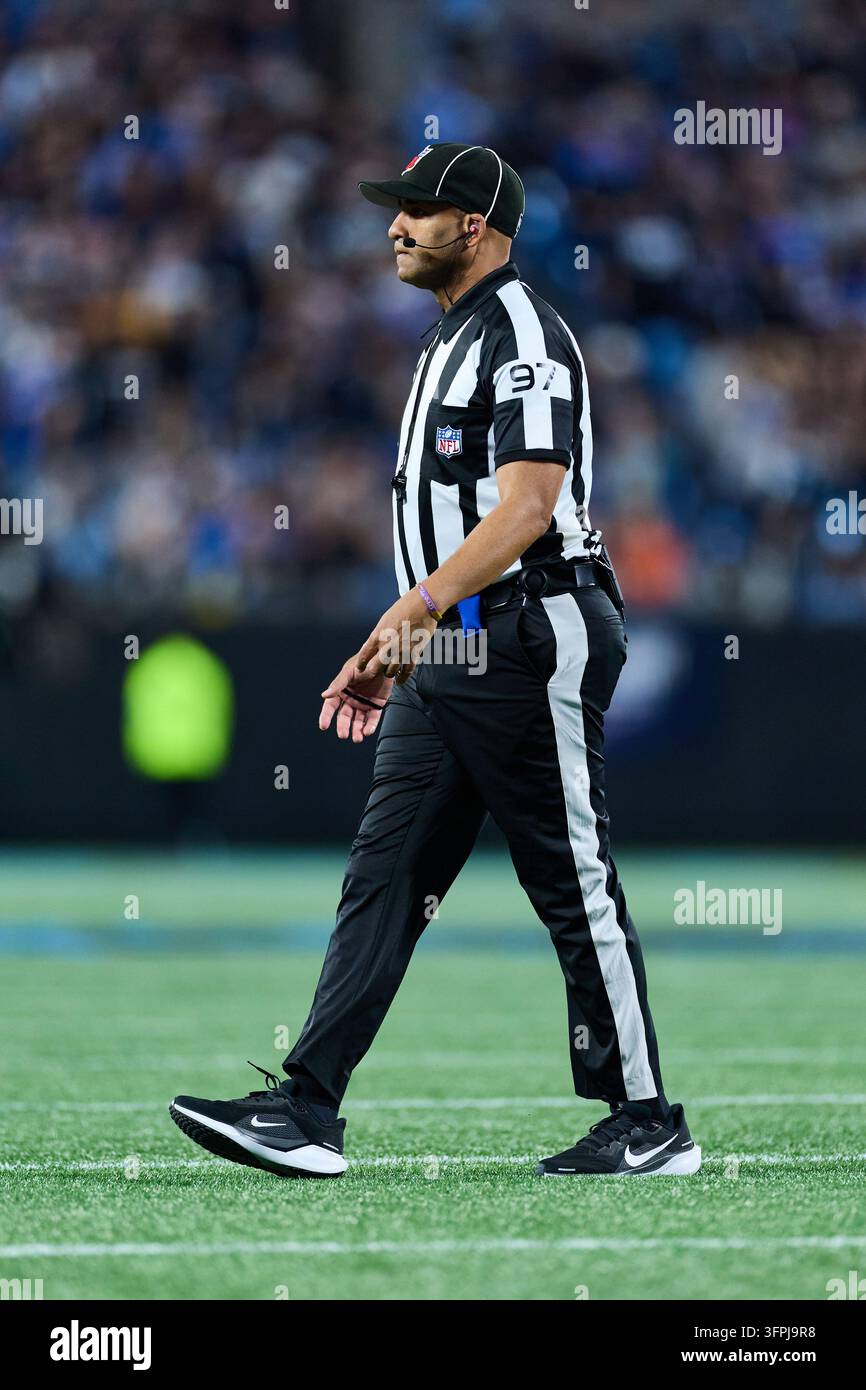 Line judge Brian Perry (97) walks across the field during an NFL ...