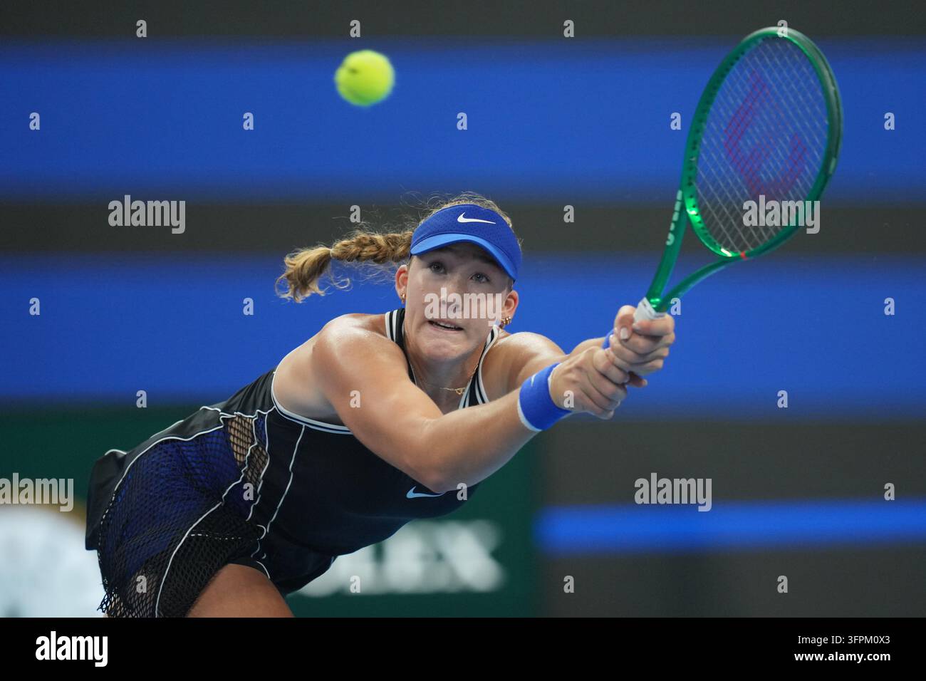 Mirra Andreeva, of Russia, returns a ball to Ekaterina Alexandrova, of Russia during the ...