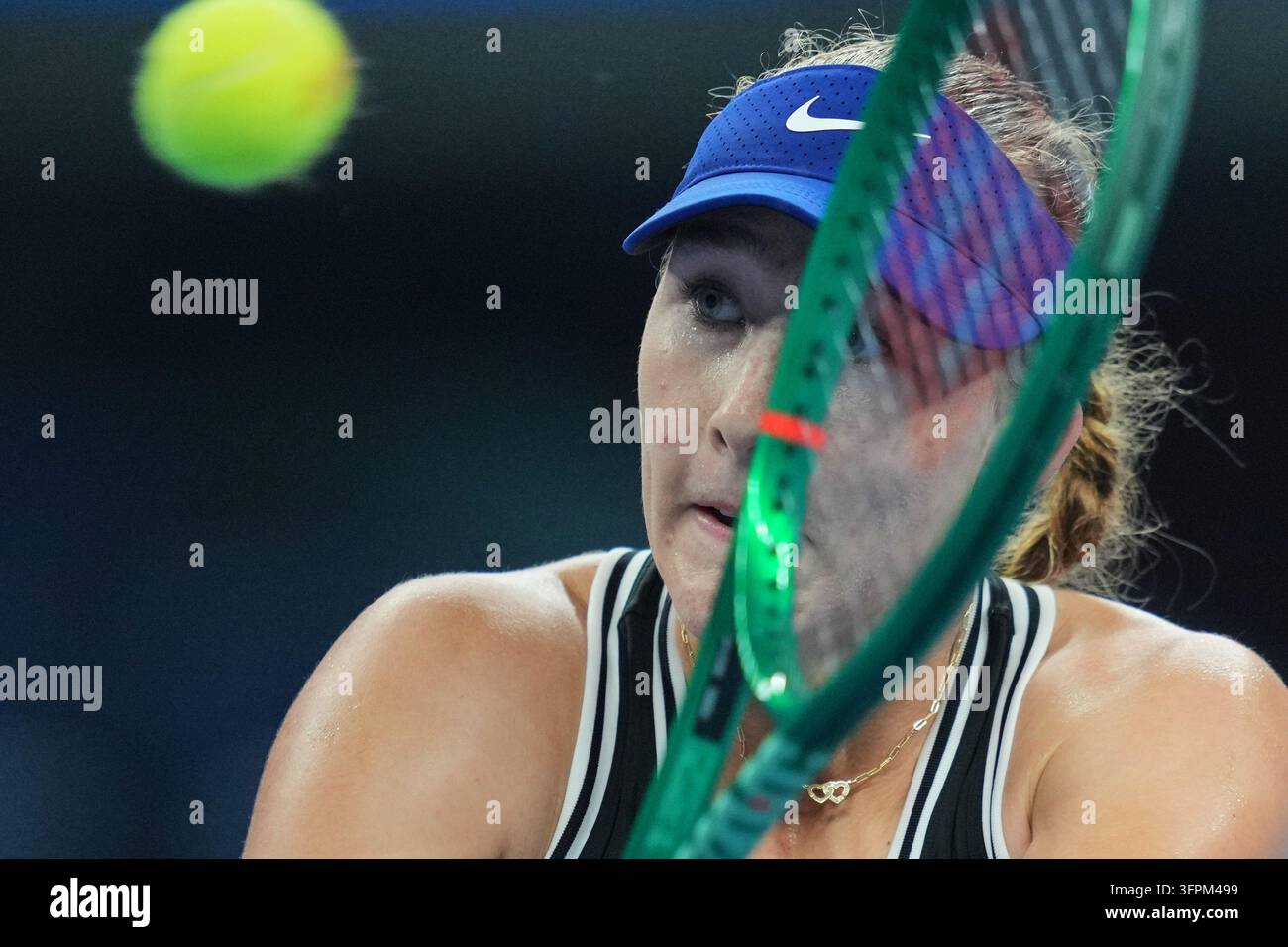Mirra Andreeva, of Russia, returns a ball to Ekaterina Alexandrova, of Russia during the ...