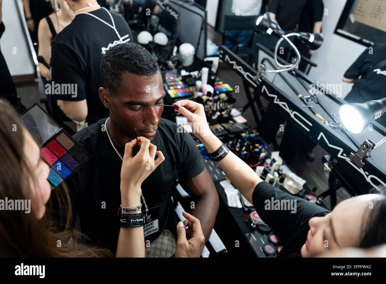 A model has their makeup done backstage during Bangkok International ...