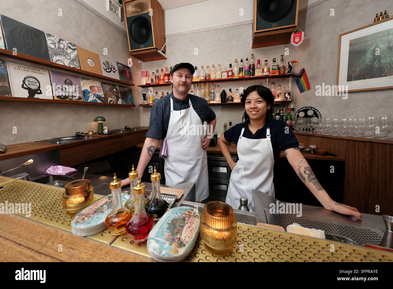Bar tender staff Alex Vowles (L) and Chantalle Narith (R) pose for a ...