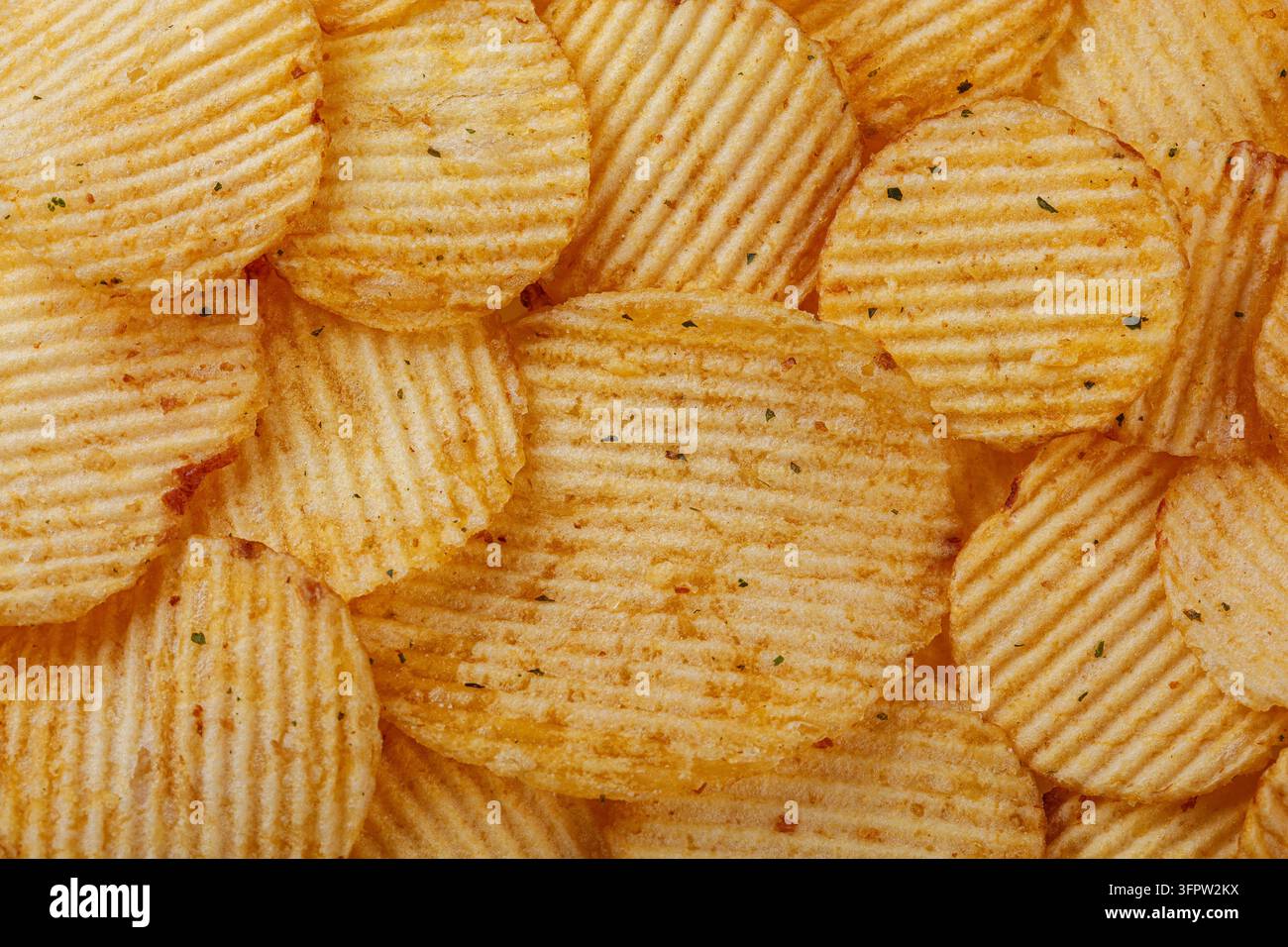 Lots of potato chips, texture close up Stock Photo