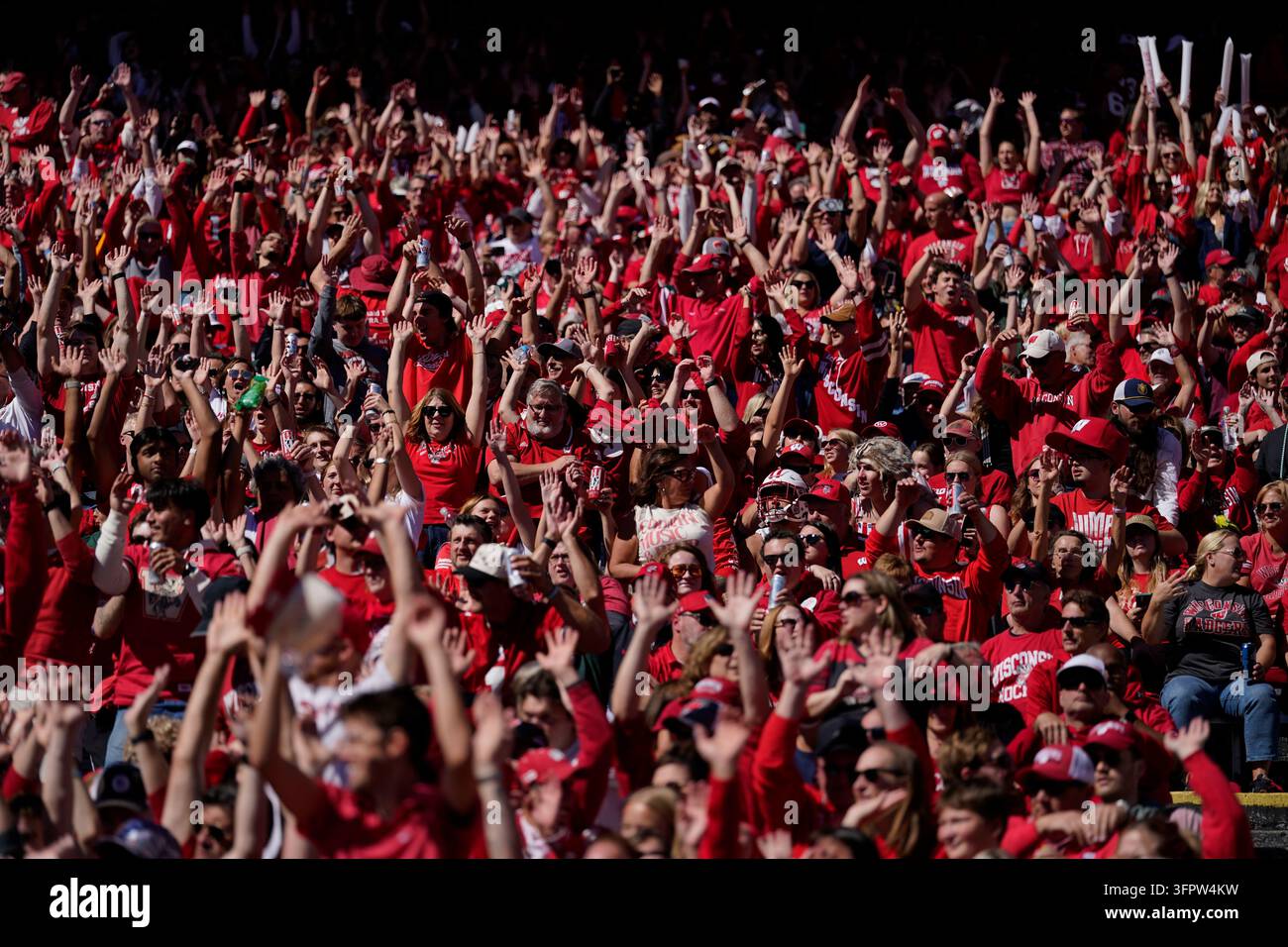 Fans cheer during an NCAA college football game between Wisconsin and ...