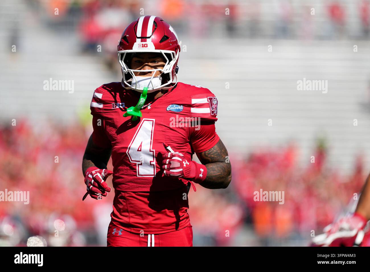 Wisconsin's Marvin Burks Jr. looks on before an NCAA college football ...
