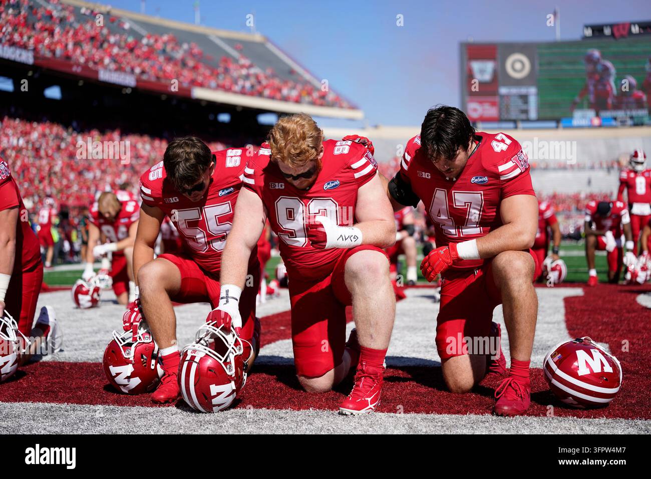 Wisconsin's Nolan Vils, Drew Braam, and Evan Van Dyn Hoven pause before ...