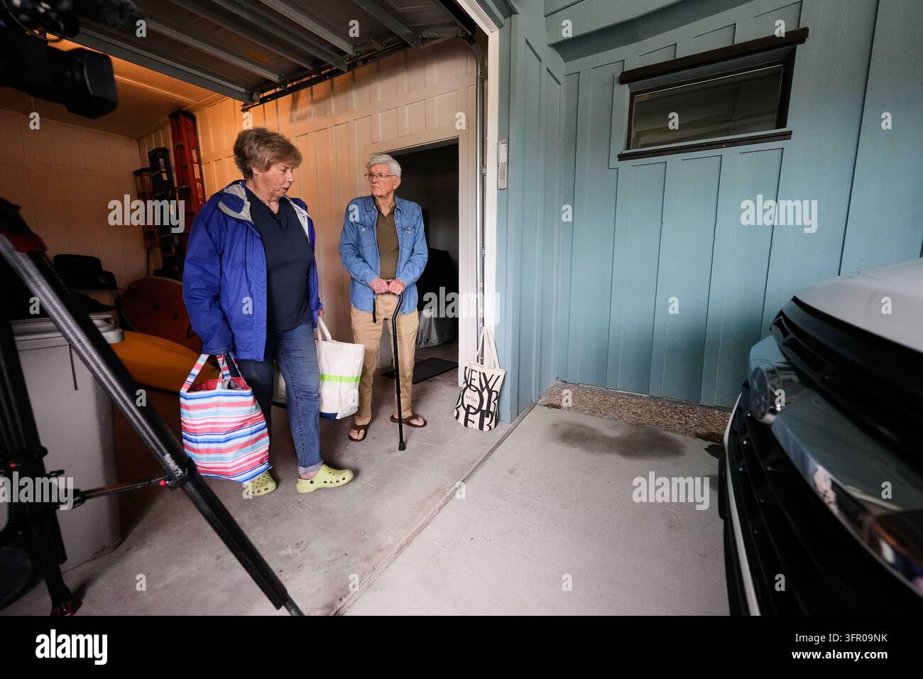 Frank Winn, 84, evacuates with his wife from his home as Hurricane ...