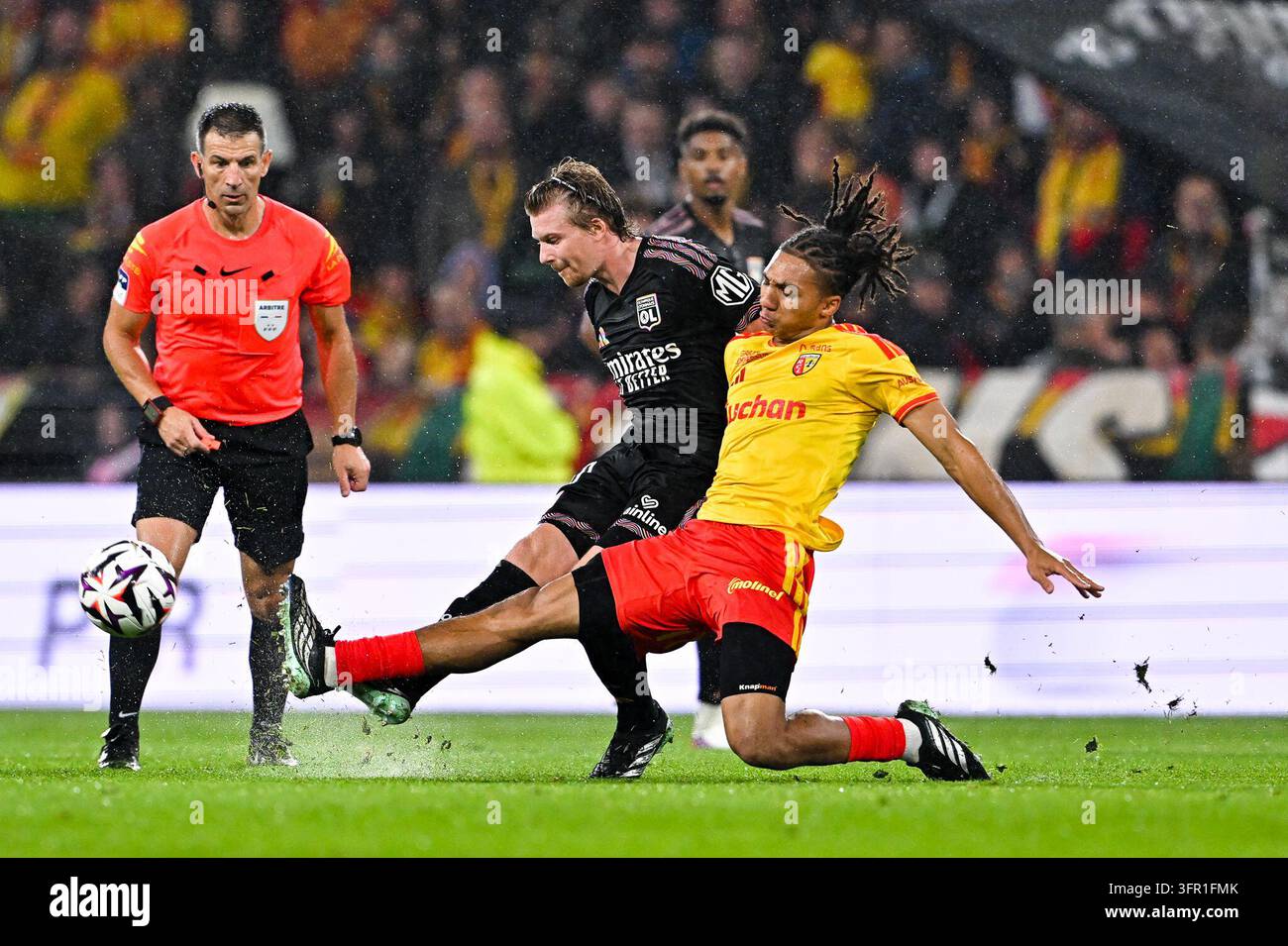 Pavel SULC of Lyon and Ismaelo GANIOU of Lens during Ligue 1 McDonald's ...