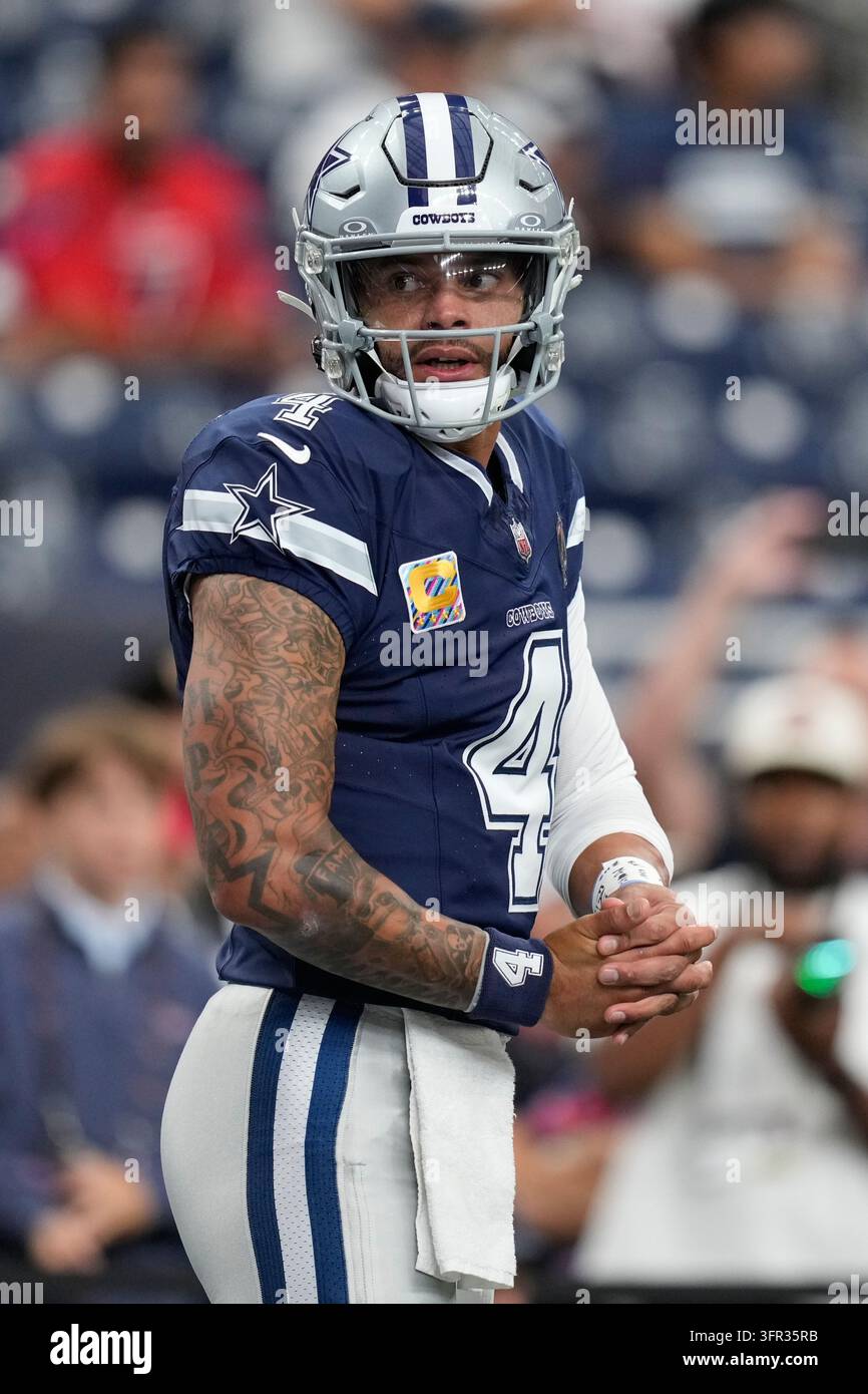 Dallas Cowboys quarterback Dak Prescott warms up before an NFL football ...