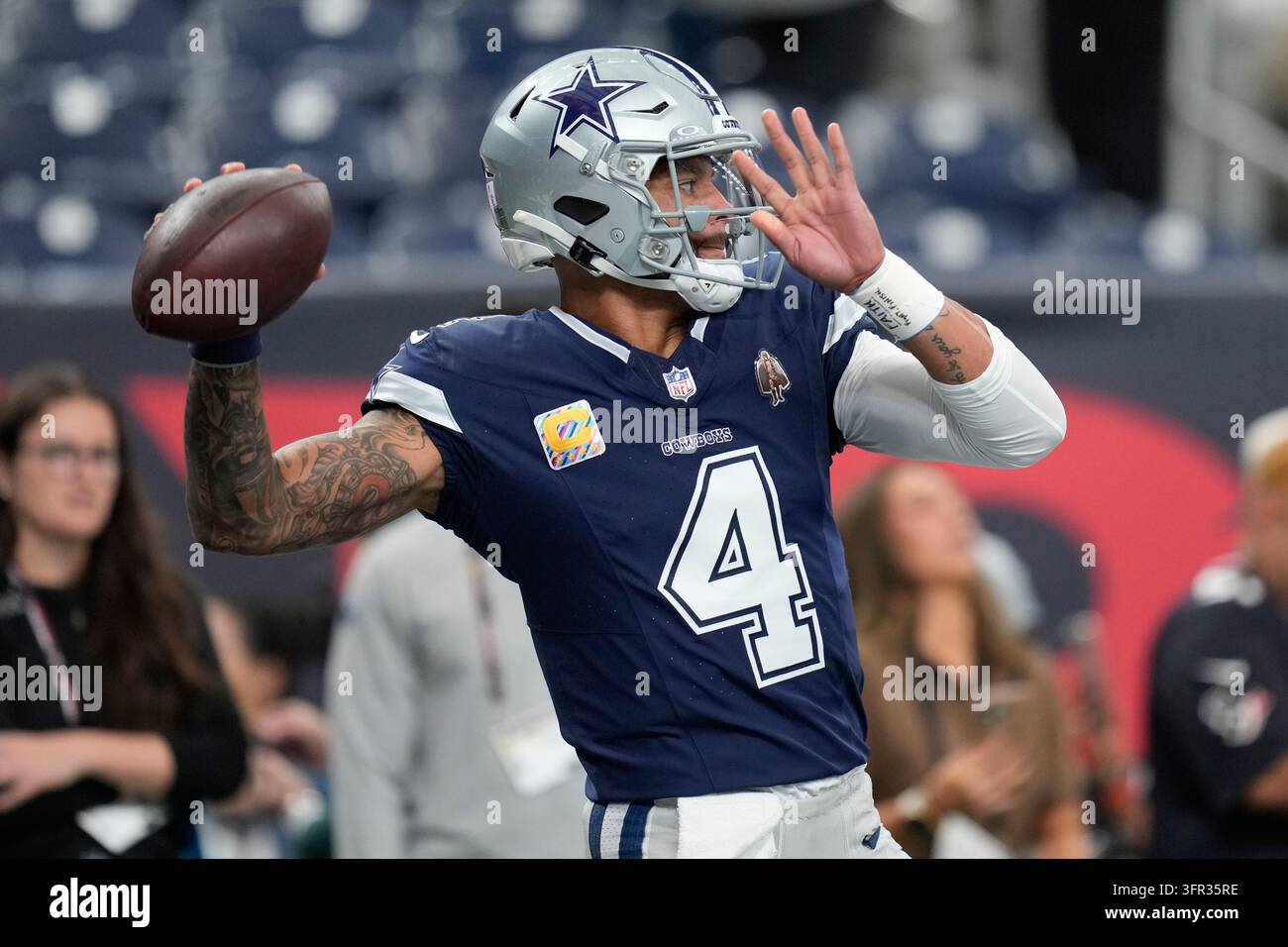 Dallas Cowboys quarterback Dak Prescott warms up before an NFL football ...