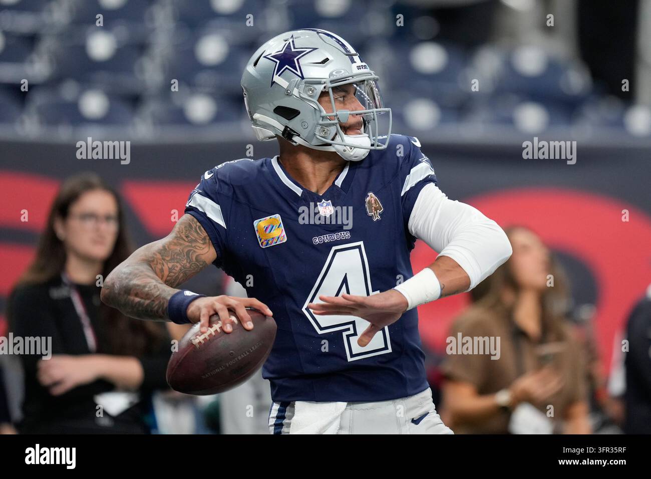 Dallas Cowboys quarterback Dak Prescott warms up before an NFL football ...