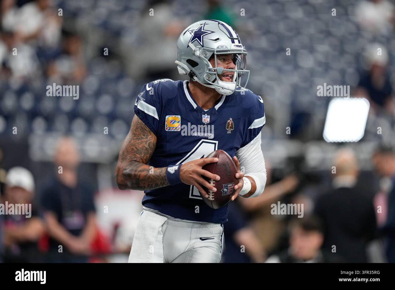 Dallas Cowboys quarterback Dak Prescott warms up before an NFL football ...