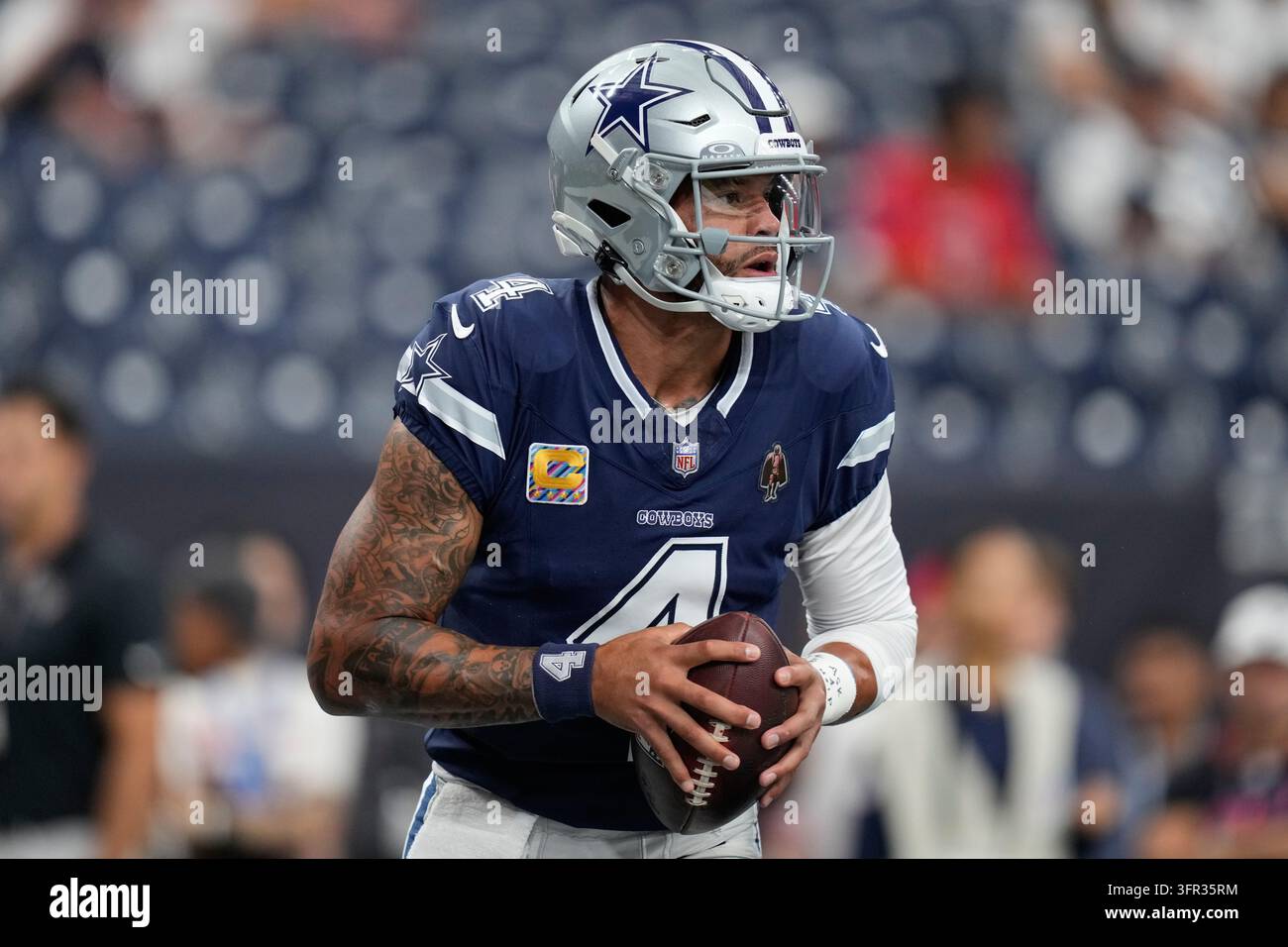 Dallas Cowboys quarterback Dak Prescott warms up before an NFL football ...