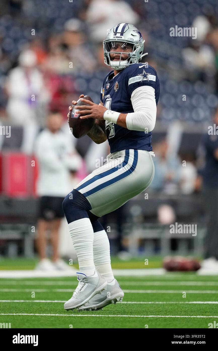 Dallas Cowboys quarterback Dak Prescott warms up before an NFL football ...