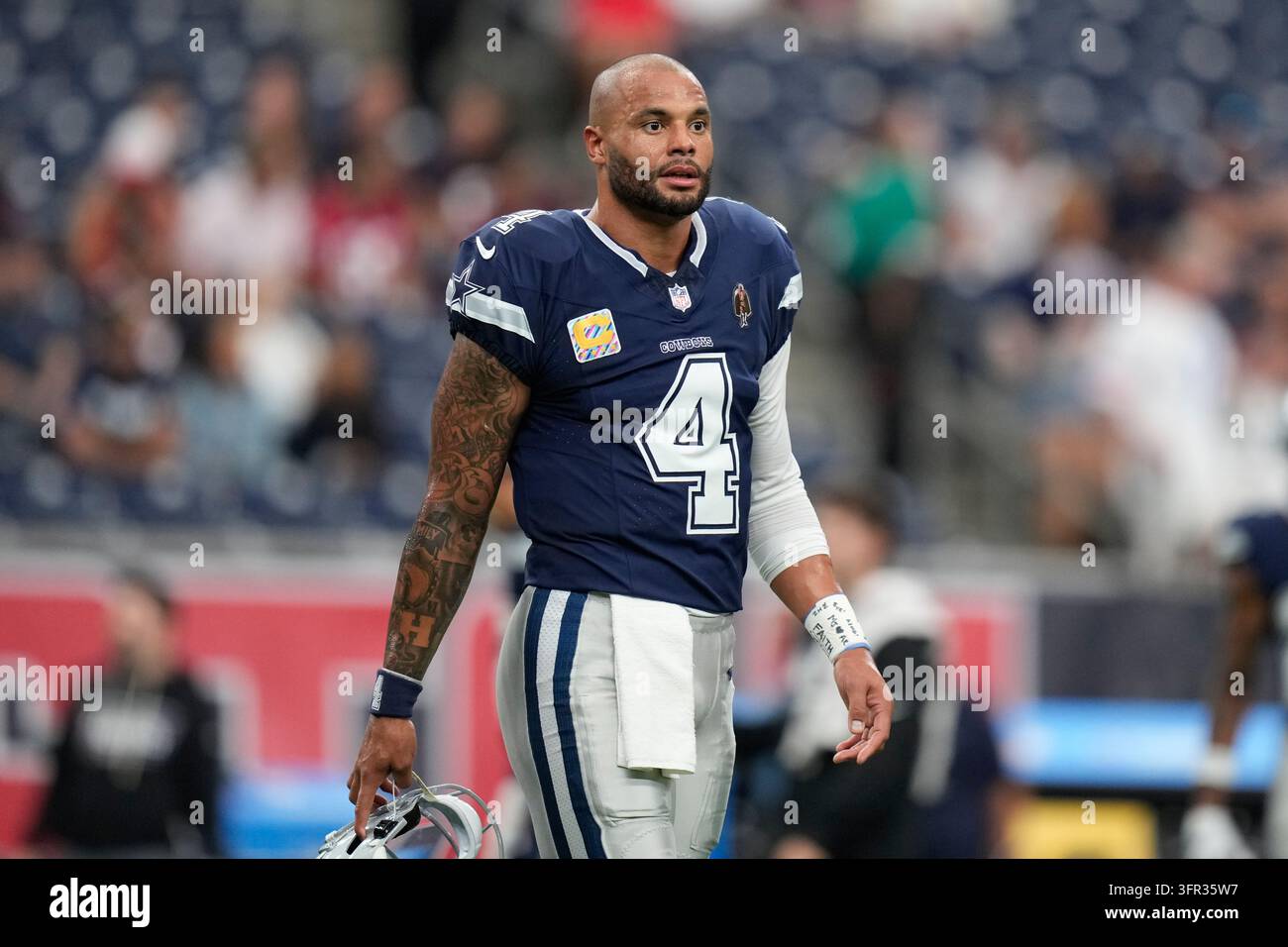 Dallas Cowboys quarterback Dak Prescott warms up before an NFL football ...