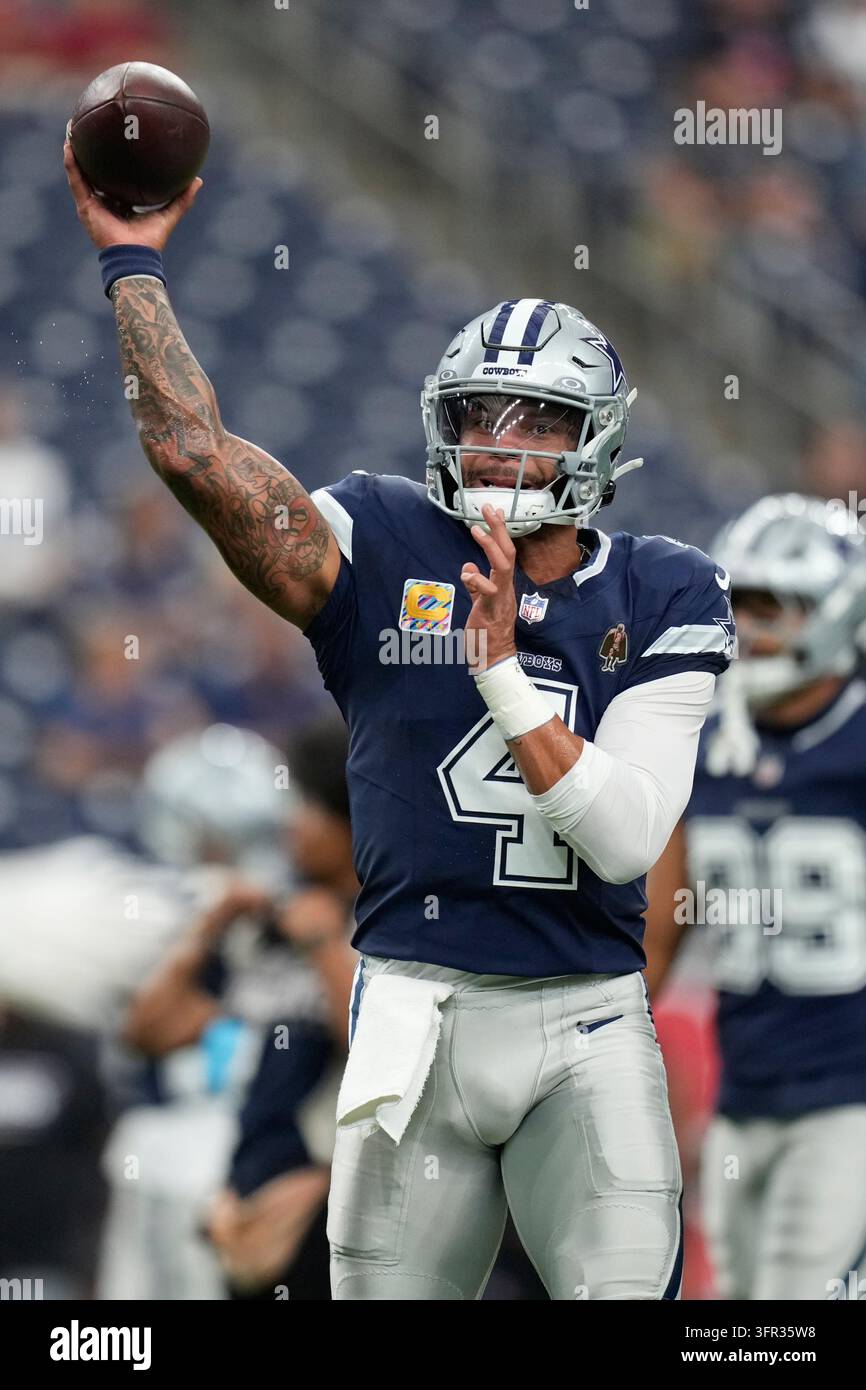 Dallas Cowboys quarterback Dak Prescott warms up before an NFL football ...