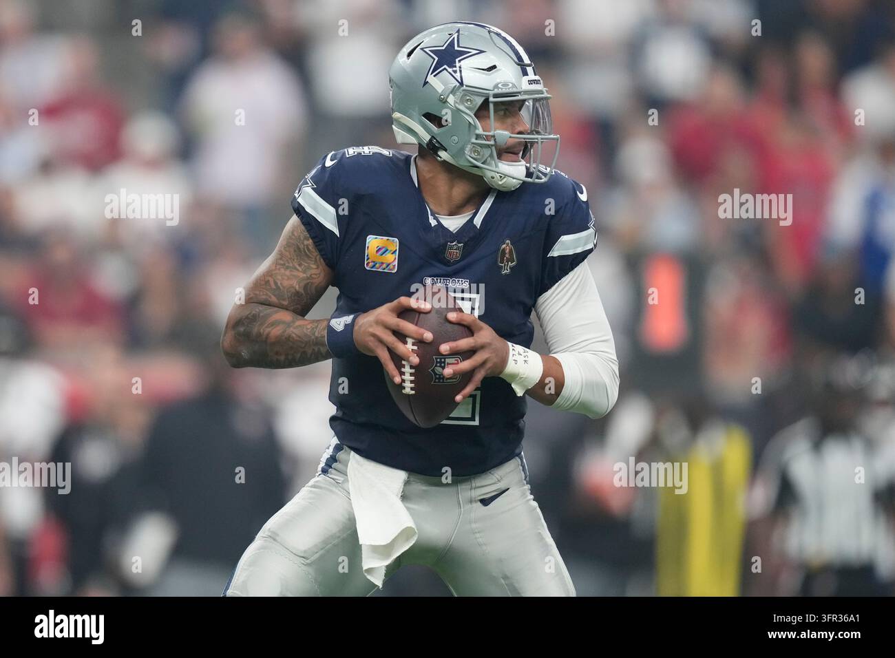 Dallas Cowboys quarterback Dak Prescott looks for a receiver during an ...