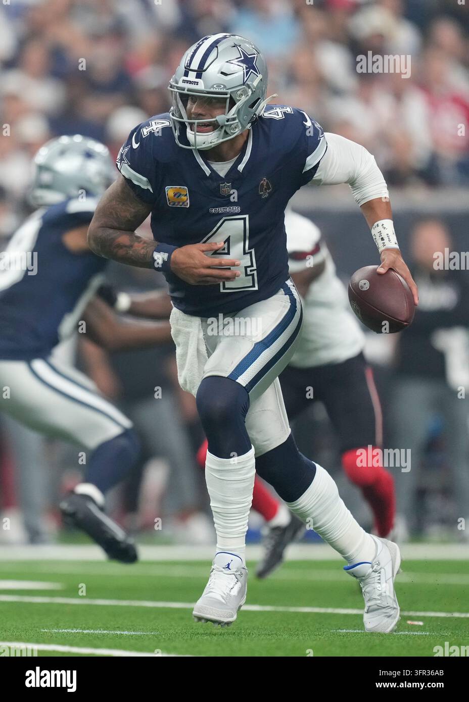 Dallas Cowboys quarterback Dak Prescott looks for a receiver during an ...