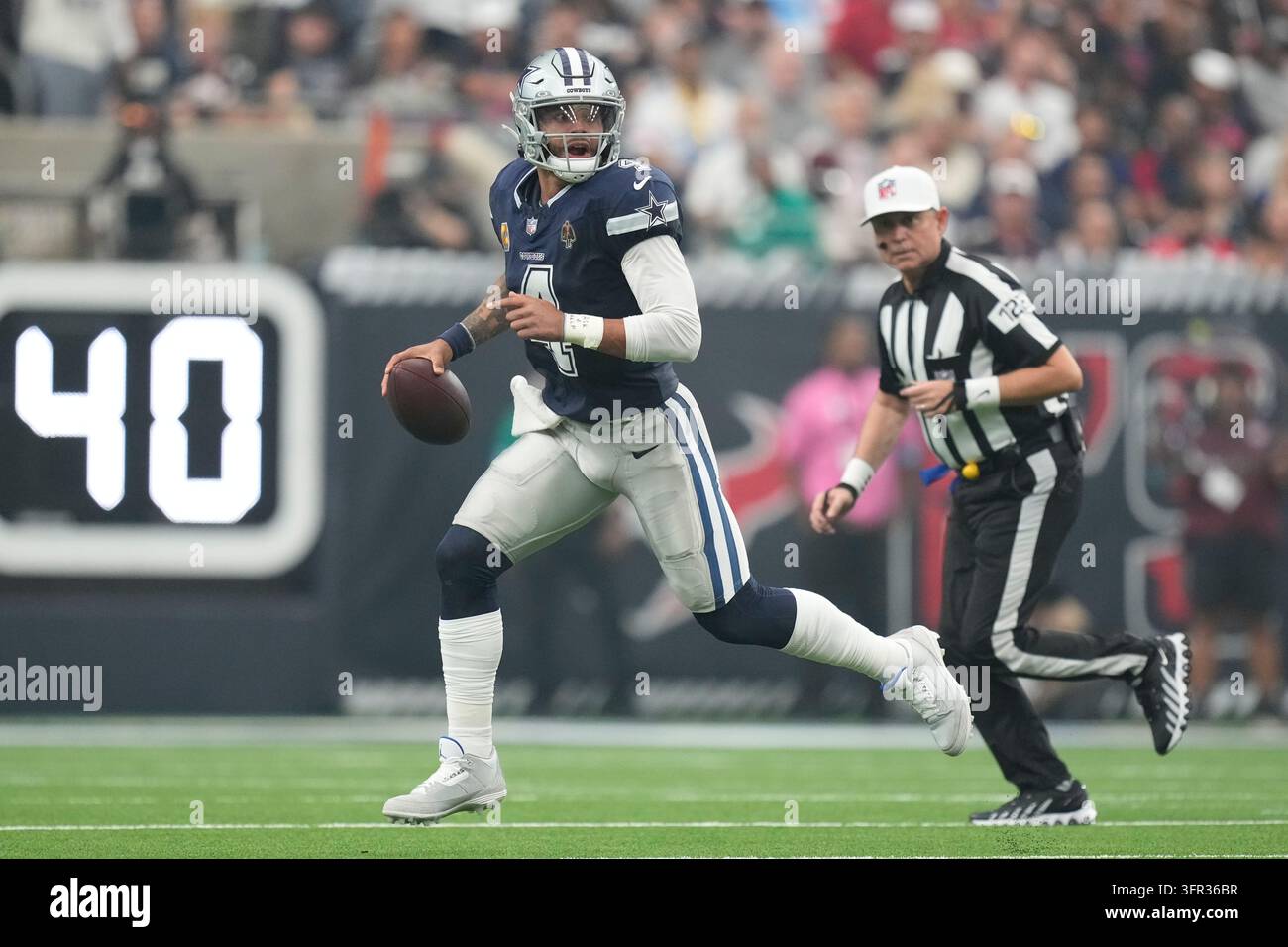 Dallas Cowboys quarterback Dak Prescott runs the ball during an NFL ...
