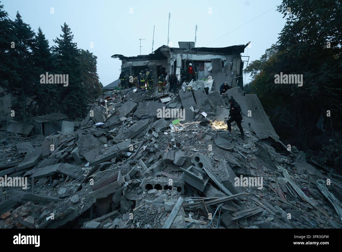 File Rescue Software Rescue workers clear the rubble of a residential building destroyed by ...