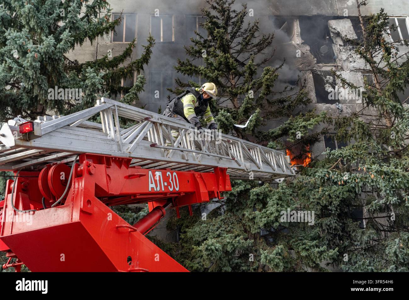File Rescue Software A rescue worker puts out a fire at a medical facility damaged in a ...