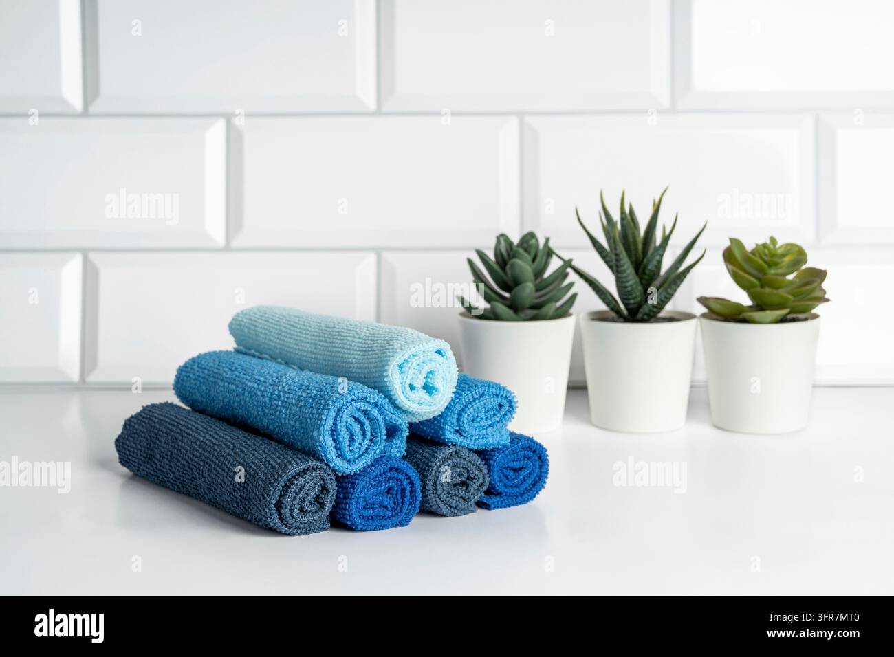Colorful microfiber towels on a modern kitchen. Kitchen utensils Stock Photo