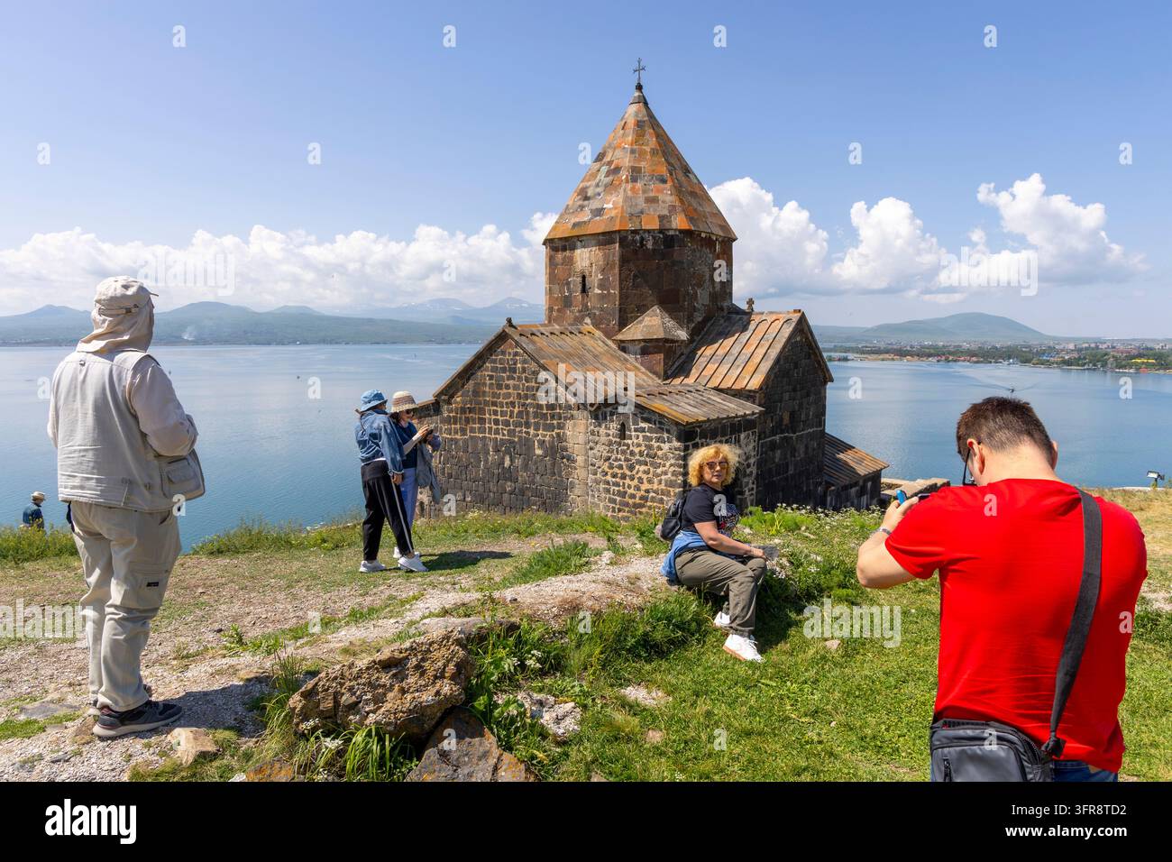 Tourists taking photos at Sevanavank Monastery by Lake Sevan, Gegharkunik Province, Sevanavank, Armenia Stock Photo