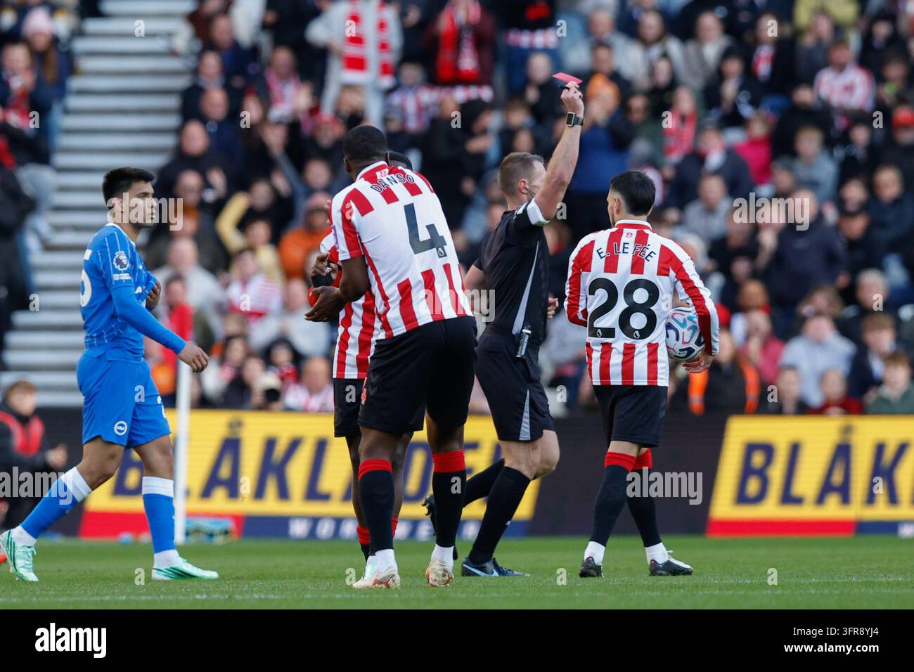 Referee Tom Bramall shows Pascal Struijk of Brighton a red card during ...