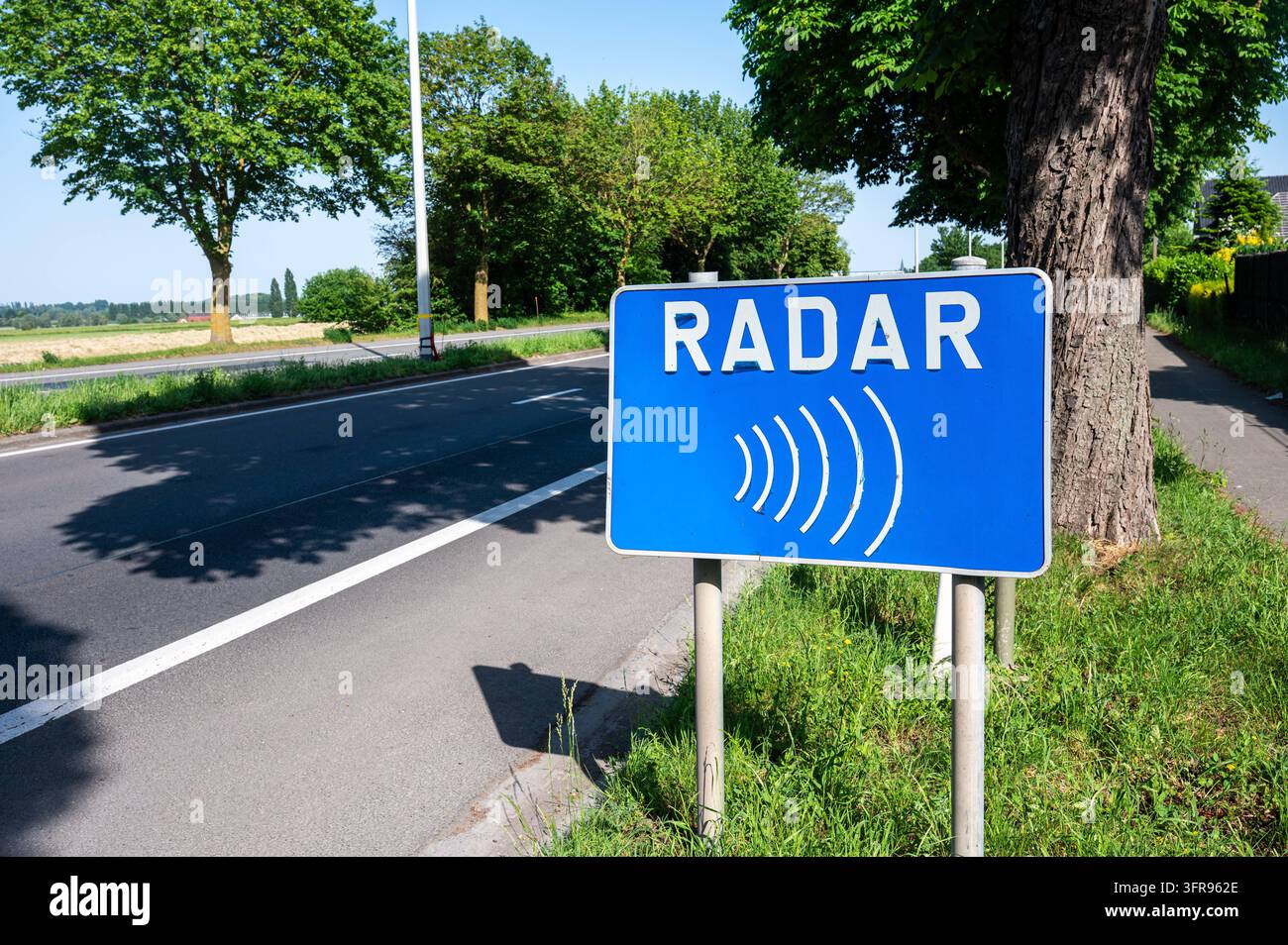 A roadside sign warns drivers of a radar enforcement area and ...