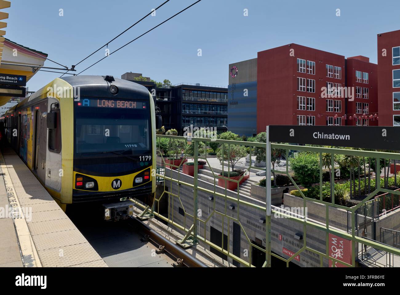 The red and maroon blossom plaza buildings in the background hi-res ...